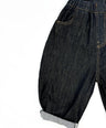Black barrel-fit denim pants for toddler boys with contrast yellow stitching and wide relaxed cut by Little Aurel.