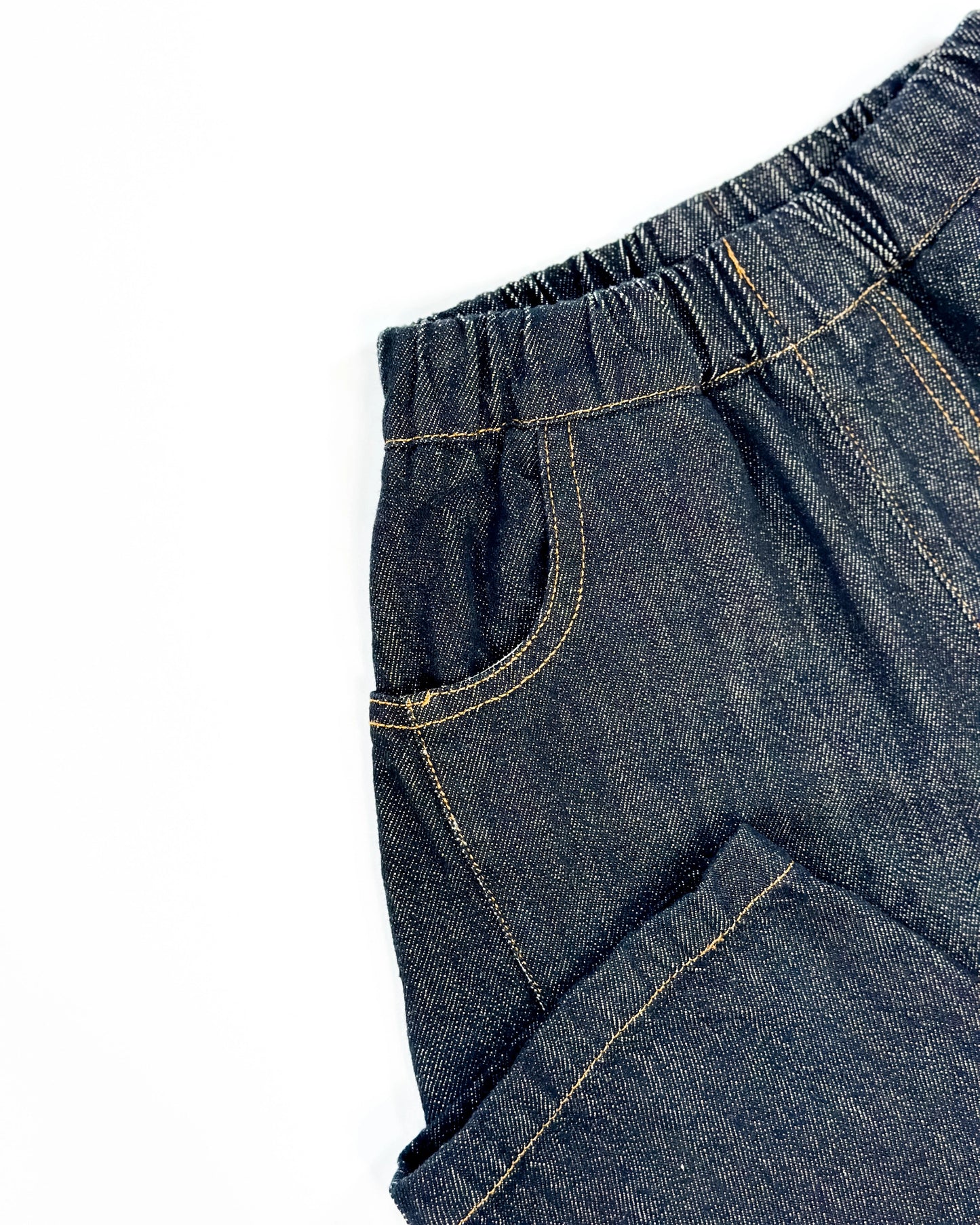 Black barrel-fit denim pants for toddler boys with contrast yellow stitching and wide relaxed cut by Little Aurel.