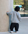 Gray cross-texture knit sweater for toddler boys with ribbed details and relaxed fit back view by Little Aurel.