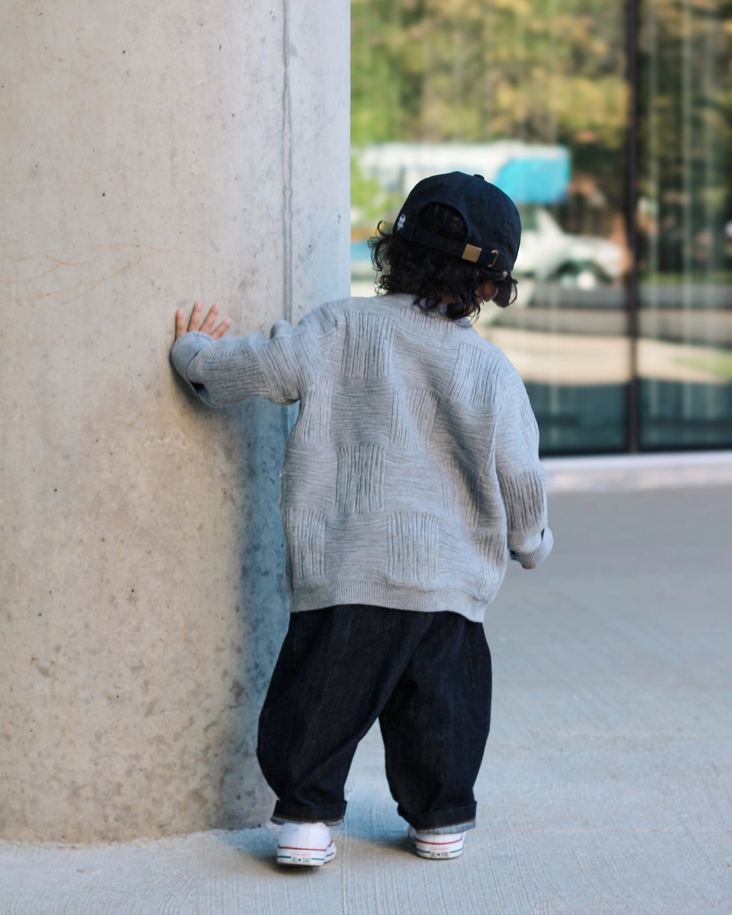 Gray cross-texture knit sweater for toddler boys with ribbed details and relaxed fit back view by Little Aurel.