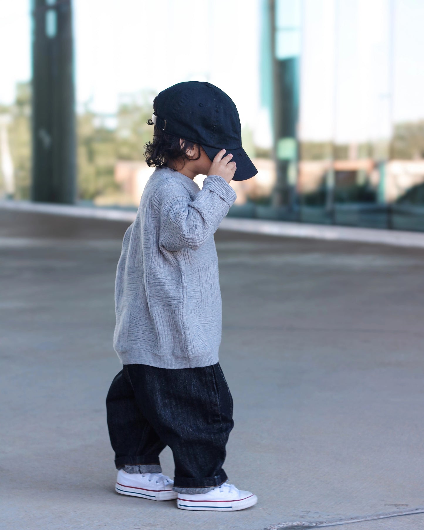 Gray cross-texture knit sweater for toddler boys with ribbed details and relaxed fit side view by Little Aurel.