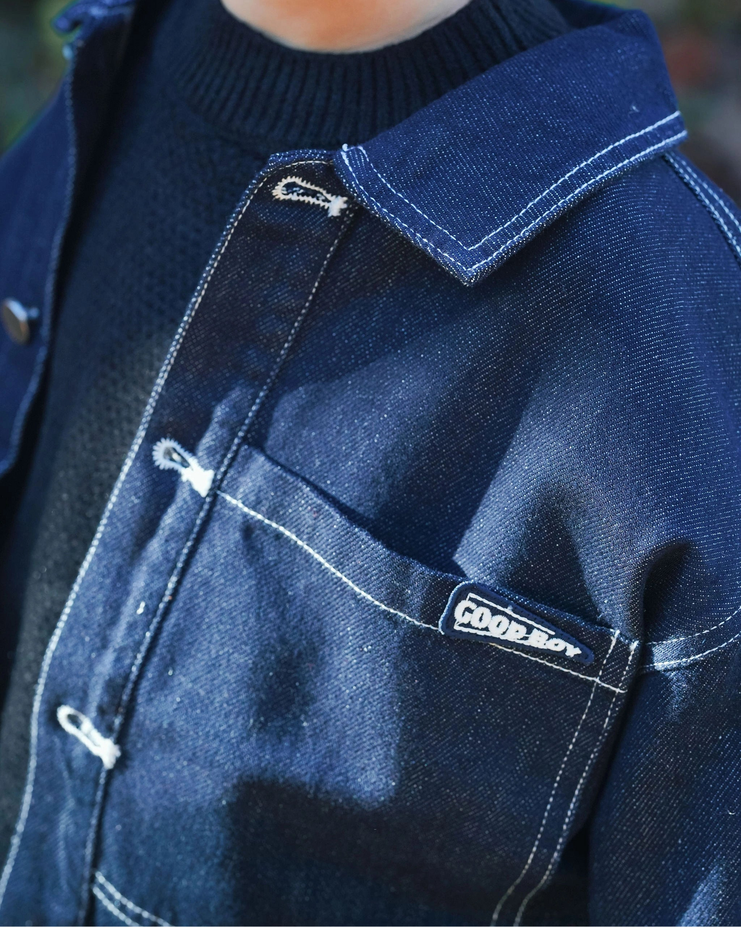 Dark blue denim jacket for toddler boys with front pocket details, silver buttons, and “Good Boy” embroidery by Little Aurel.