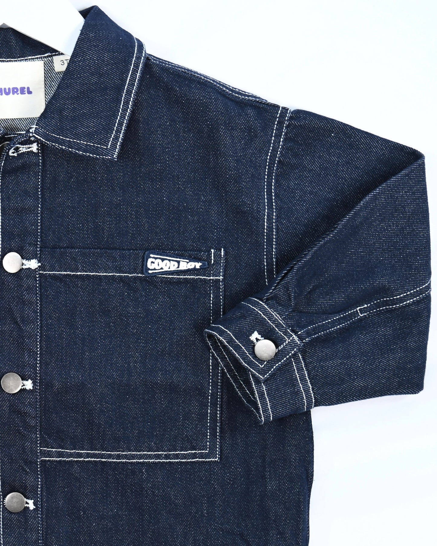 Dark blue denim jacket for toddler boys with front pocket details, silver buttons, and “Good Boy” embroidery by Little Aurel.