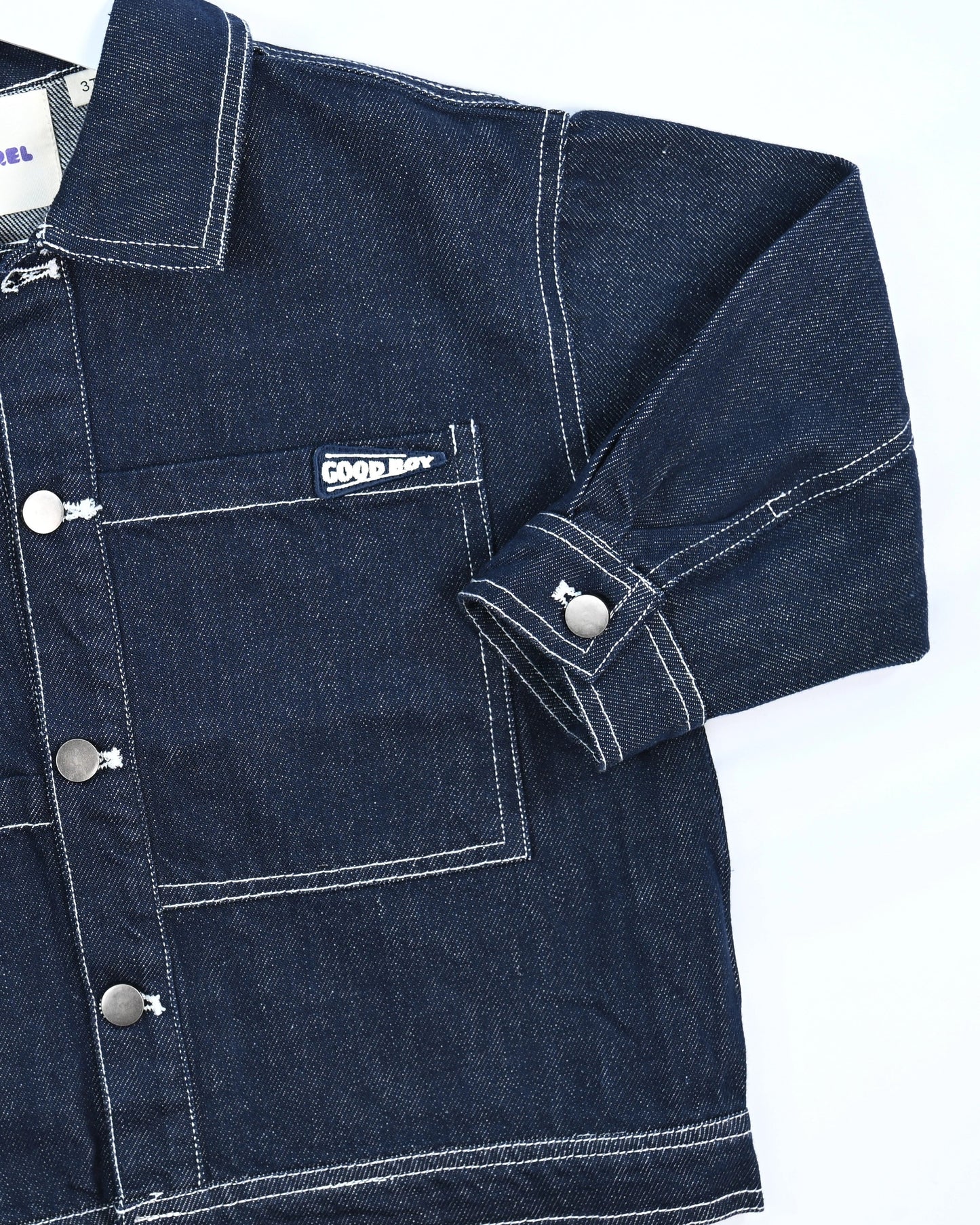 Dark blue denim jacket for toddler boys with front pocket details, silver buttons, and “Good Boy” embroidery by Little Aurel.