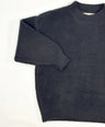 Black knit pullover for toddler boys with cream neckline and cuffs by Little Aurel.