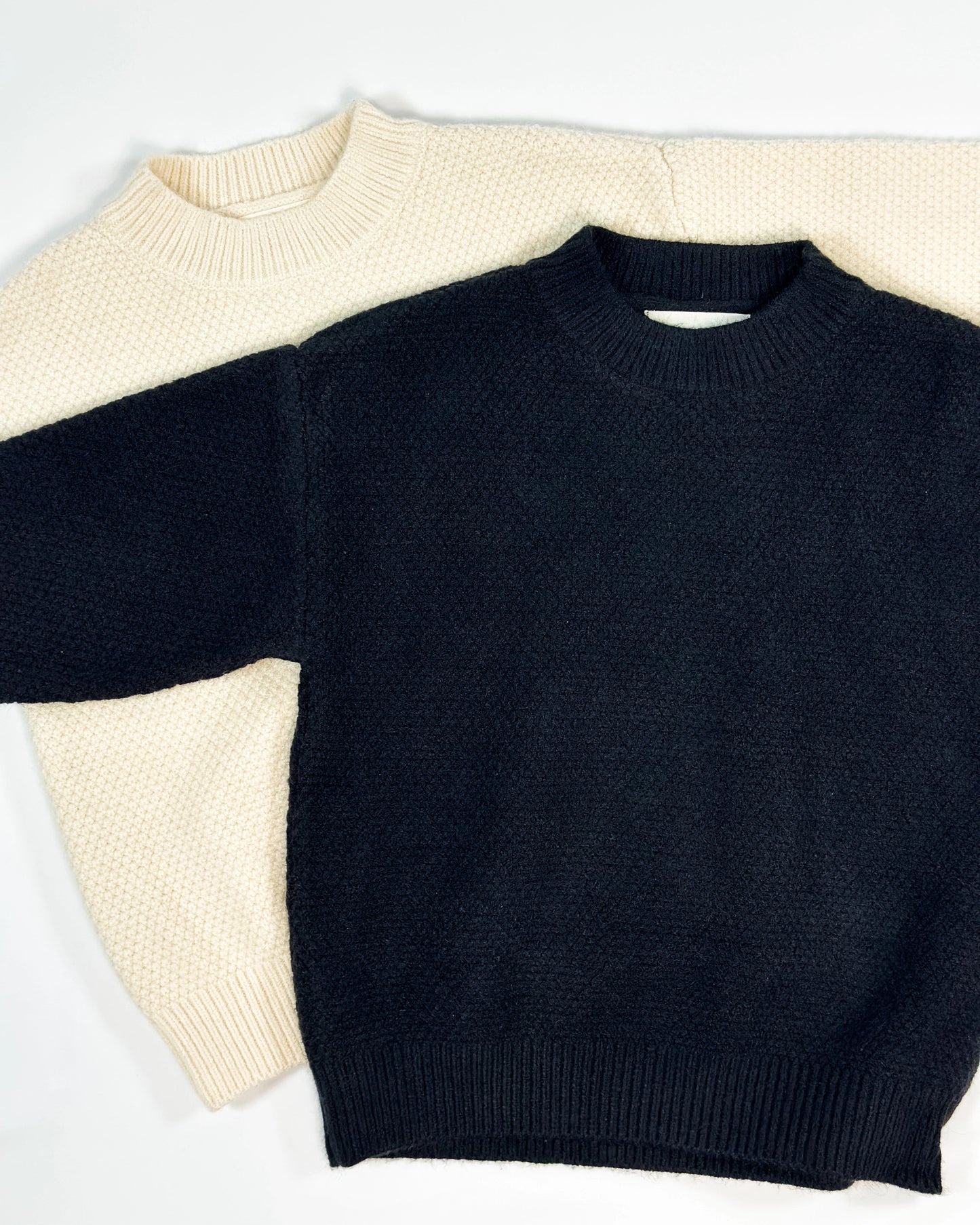 Cream and Black colored knit pullover for toddler boys  by Little Aurel.