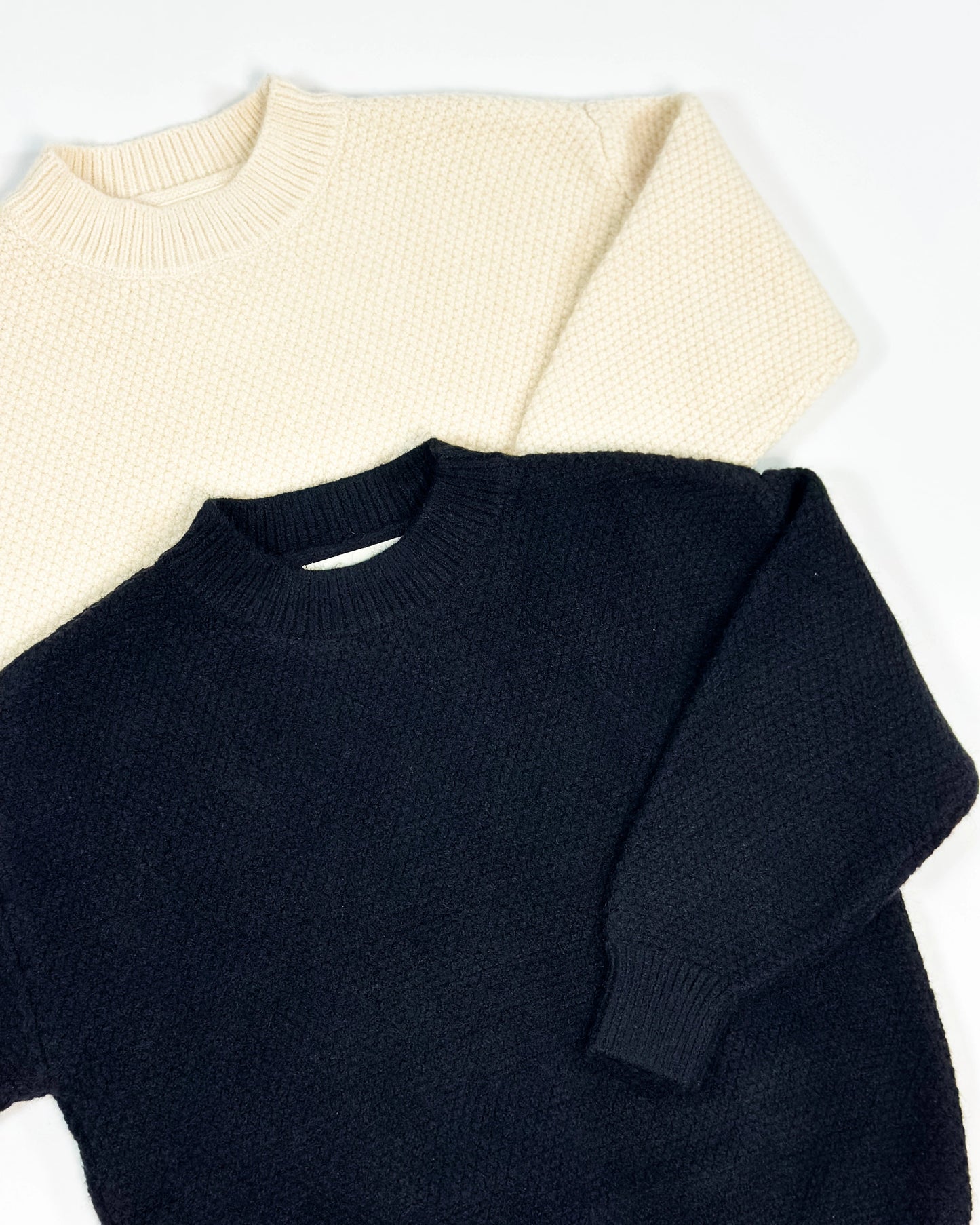 Black and cream colored knit pullover for toddler boys by Little Aurel.