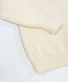 Cream knit pullover for toddler boys  by Little Aurel.