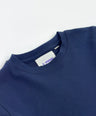 Loose-fit longsleeve shirt for kids in navy blue with small dinosaur embroidery
