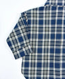 Oversized plaid blouse for toddler boys in navy and grey with front pocket and button-down design by Little Aurel.