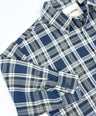 Oversized plaid blouse for toddler boys in navy and grey with front pocket and button-down design by Little Aurel.