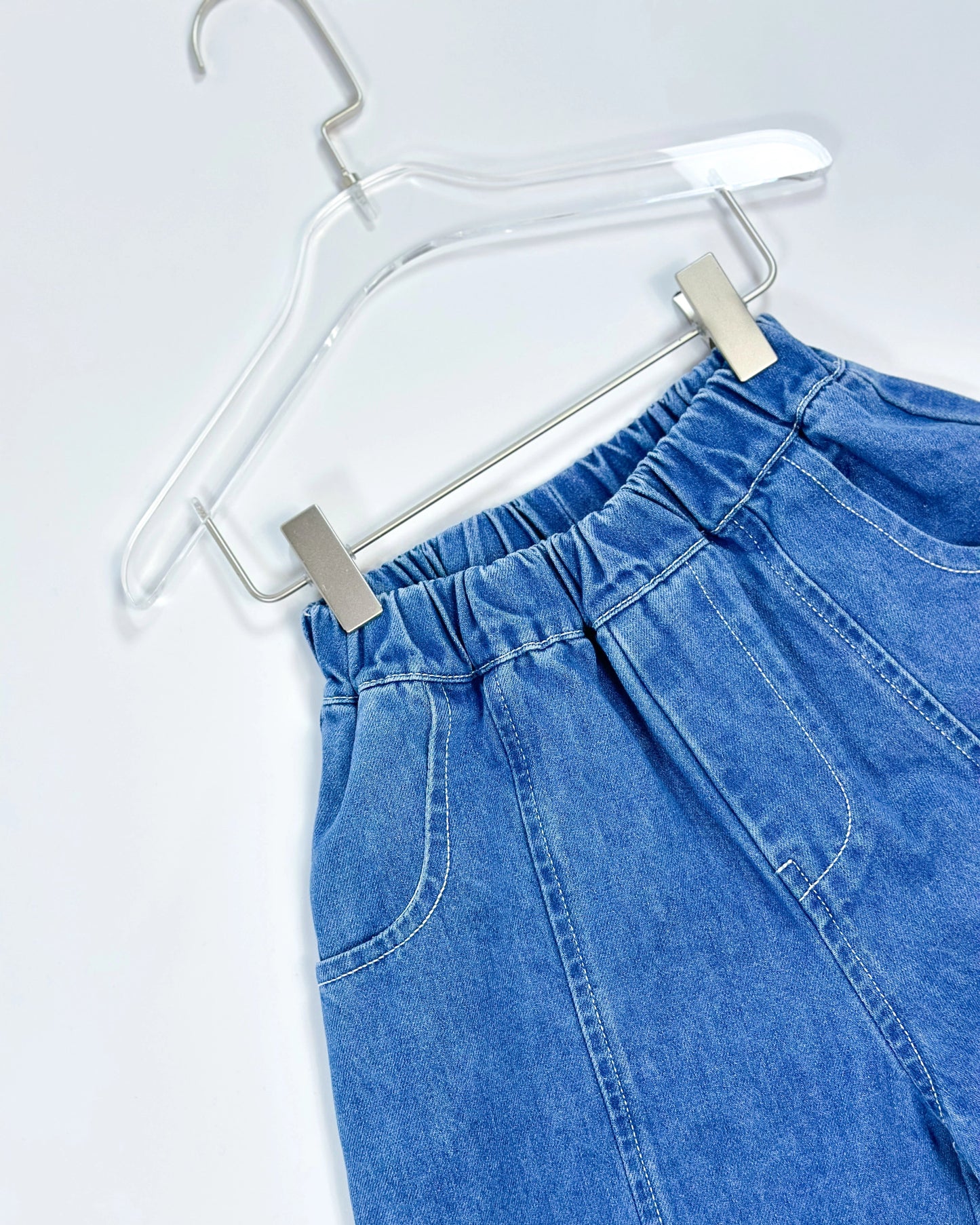 Signature denim pants for toddler boys in blue washed look with wide barrel fit and deep front pockets by Little Aurel.
