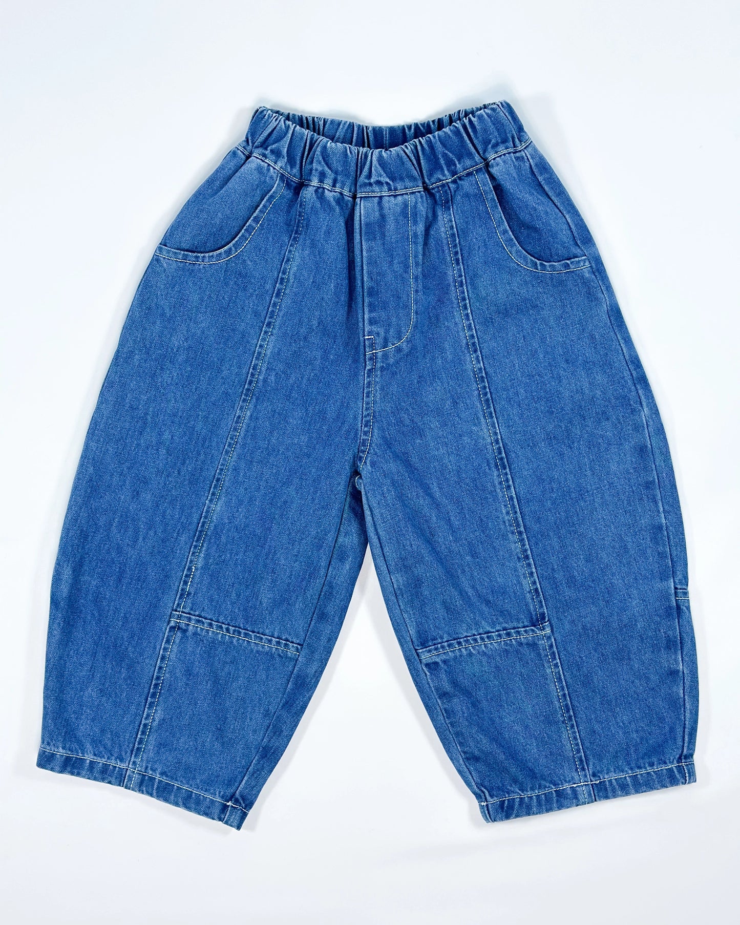 Signature denim pants for toddler boys in blue washed look with wide barrel fit and deep front pockets by Little Aurel.
